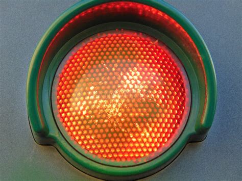 Red Traffic Light Isolated On Gray Background Close Up Stock Photo
