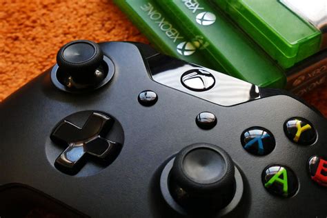 Xbox One Controller Beside Three Xbox One Cases · Free Stock Photo