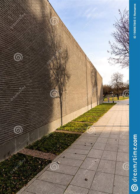 High Brick Wall With Shadows And Sidewalk Stock Image Image Of Beauty
