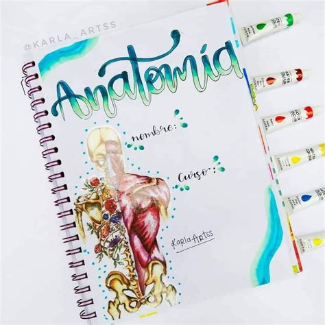 an open spiral notebook with the words anatomid on it