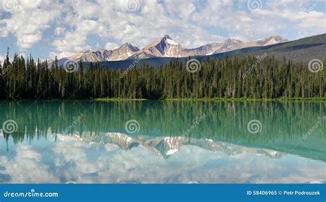Mountains And Clouds Reflected In A Mountain Lake Stock Image Image