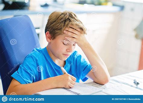 Young Boy Doing His Homework At Home School Kid Learning Stock Photo