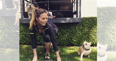 Chrissy Teigen Flashes Her Cleavage As She Gets Ready For A Workout