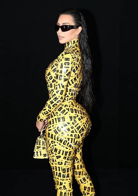 kim kardashian makes a bold statement at the balenciaga show flaunting her iconic curves in