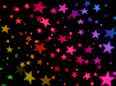 Colorful Stars Are Shown Against A Black Background