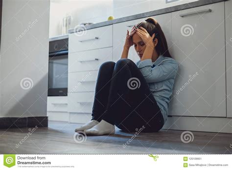 Depressed Woman Sitting On A Kitchen Floor Stock Image Image Of