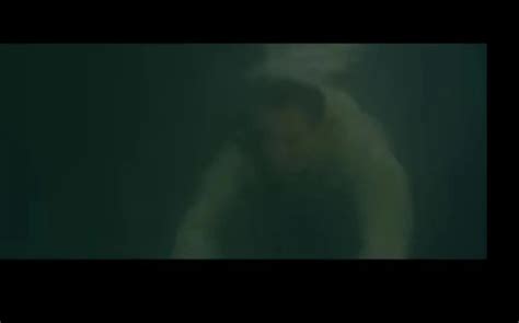 Clothed And Barefaced Underwater In Sea