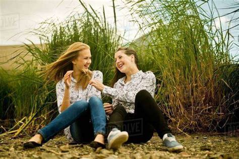 Two Babe Women Laughing In Breeze Stock Photo Dissolve