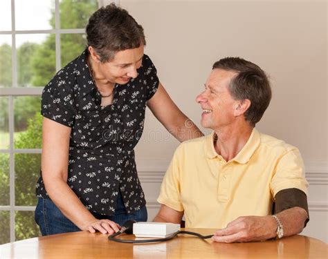 Senior Man Taking Blood Pressure With Wife Stock Image Image Of