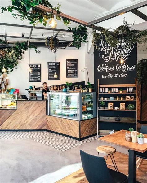 See more ideas about cafe interior, cafe interior design, cafe design. What a pretty coffee shop: So much wood and so many plants. | Juice bar design, Coffee shops ...