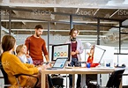 People Working Together On The Computers In The Office Stock Photo ...