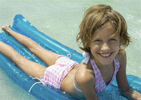 Girl Lying On Raft Stock Photo Dissolve