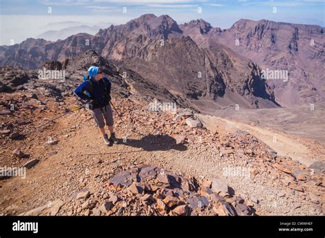 A Hiker Pauses On The Descent Of Toubkal The Tallest Mountain In