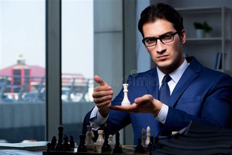 The Businessman Playing Chess In Strategy Concept Stock Photo Image