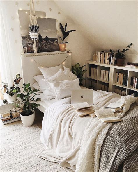 Simple But Cozy Bedroom With Tons Of Books And Plants By