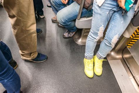 People Legs And Feet Inside Subway Train Blurred View Stock Photo
