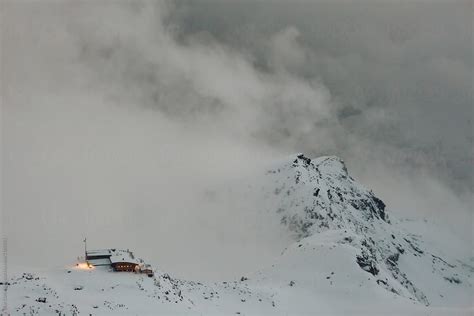 Winter Mountain Cabin Covered In Snow In The Top Of The Alpine