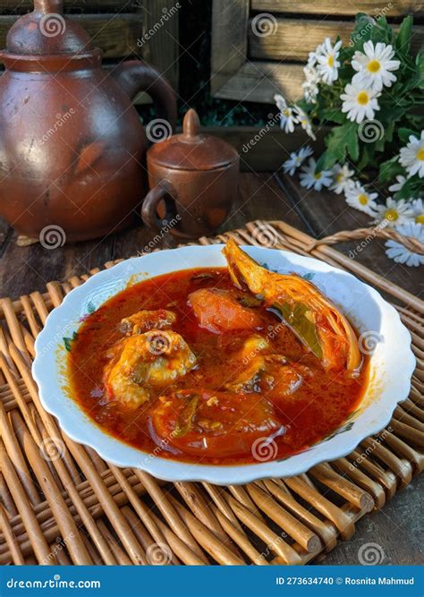 Malaysia Hot Spicy And Sour Fish Chicken Called Asam Pedas Stock Photo