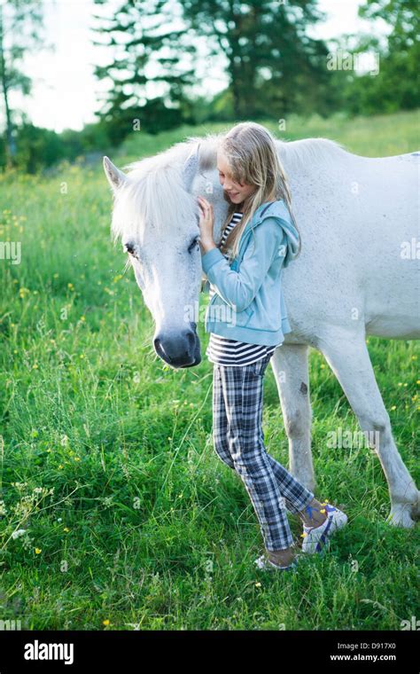 Girl With White Horse Stock Photo Alamy