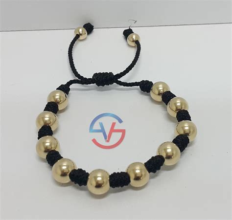 Pulsera Con Bola Laminada En Oro De 18k - $ 94.900 en Mercado Libre