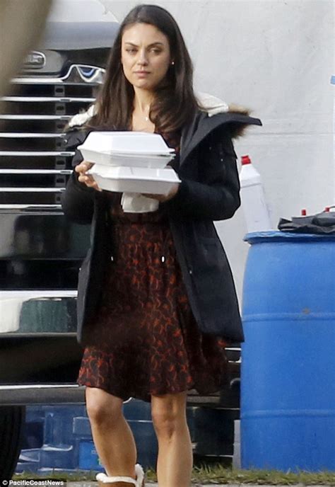 Mila Kunis Teams Her Pretty Red Dress With Cosy Boots On Bad Moms Set