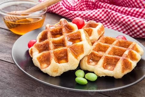Waffles With Honey On Plate 1255150 Stock Photo At Vecteezy