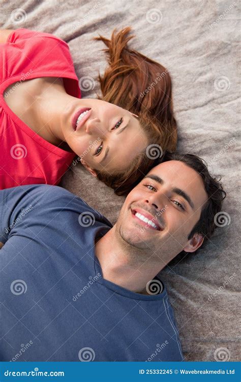 Close Up Of Two Friends Looking Into The Sky While Lying Stock Image