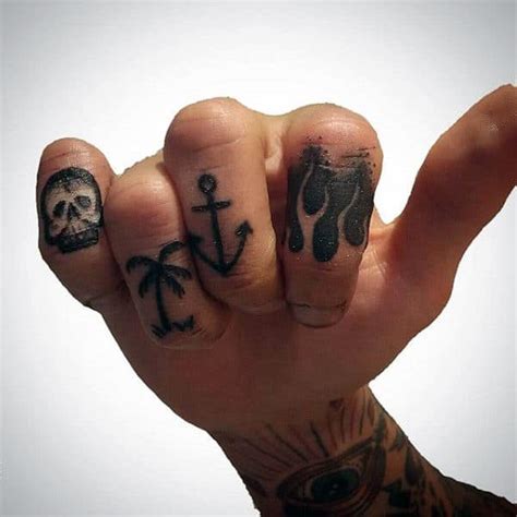 These are quite widely used in tattoo designs. 75 Finger Tattoos For Men - Manly Design Ideas