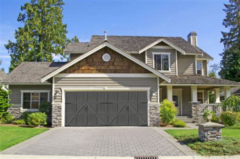 Large classic american house with three car garage. 2018 Trend Alert: Gray and Black Garage Doors Are "IN ...