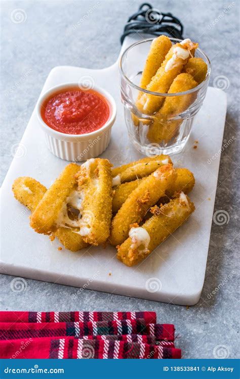 Breaded Fried Mozzarella Cheese Sticks With Ketchup Dipping Sauce Stock