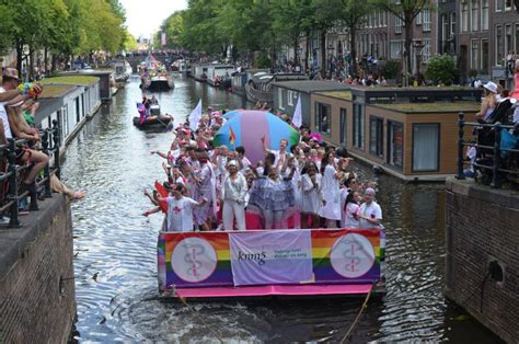 amsterdam netherlands august 06 2022 many people in boats at lgbt pride parade on river