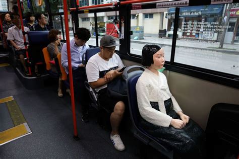 Why Chilling Statues Of Women Have Appeared In Buses In South Korea