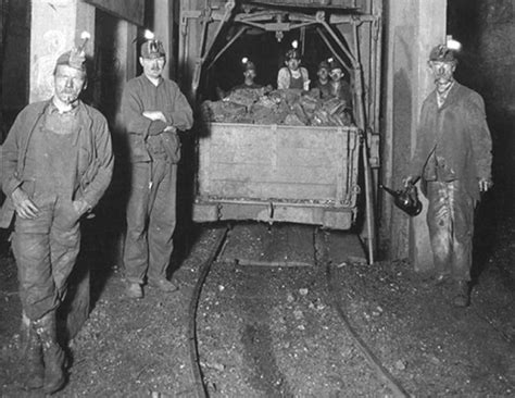 Old Photo Showing Several Miners In Front Of A Loading Cage Early 1900