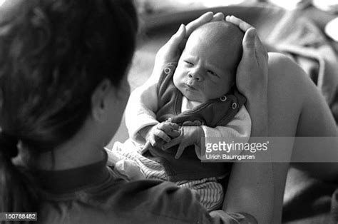 Black Woman Holding Newborn Baby Photos And Premium High Res Pictures