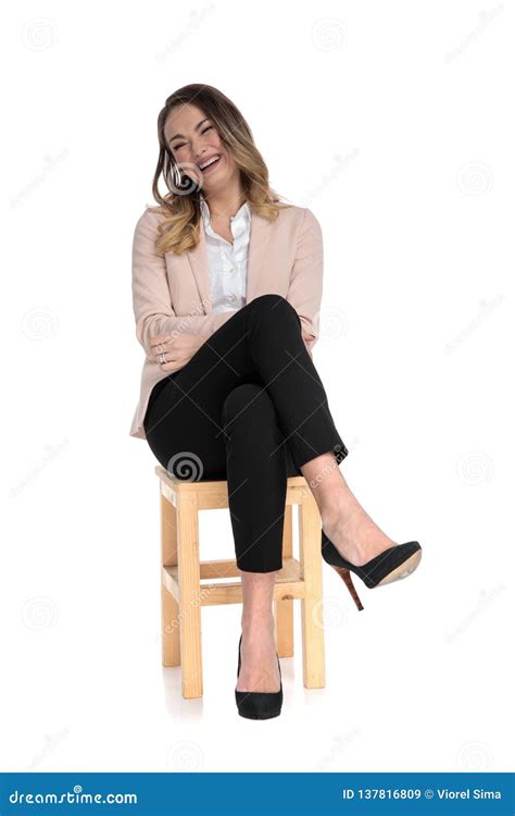 Relaxed Businesswoman Sits On Chair Cross Legged And Laugh Stock Image