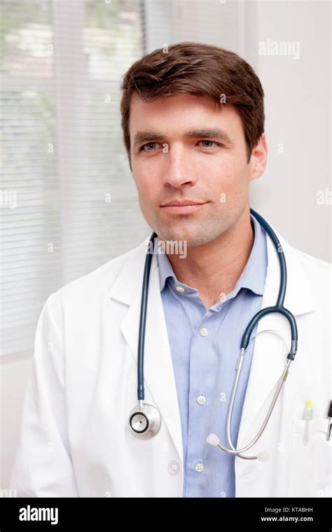 Male Doctor In Uniform Looking Away Portrait Stock Photo Alamy