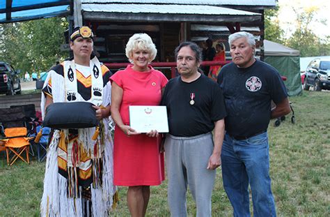 cheryl gallant presents diamond jubilee medal to tony amikons of pikwaknagan cheryl gallant