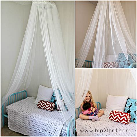 Now gently pull down on the fabric hanging between the rings to drape it slightly; Craftaholics Anonymous® | How to make a Bed Canopy