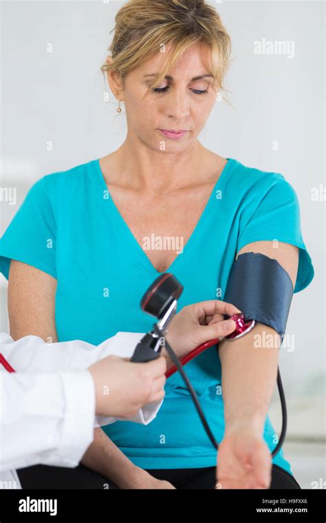 Doctor Measuring The Blood Pressure Of The Patient Stock Photo Alamy