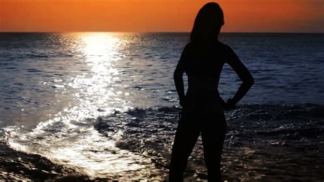 mysterious silhouette sexy girl at beach during sunset closeup stock footage video 2894365
