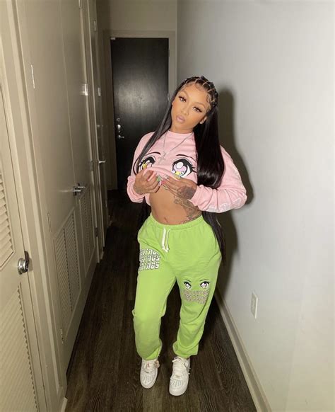 cuban doll keeps it cozy in fashion nova graphic pink sweatshirt and green sweatpants biz grows