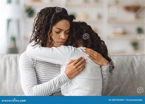 Little Black Girl Crying On Mothers Shoulder Stock Photo Image Of