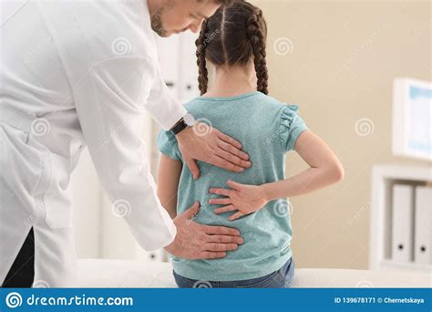 Chiropractor Examining Child With Back Pain Stock Image Image Of