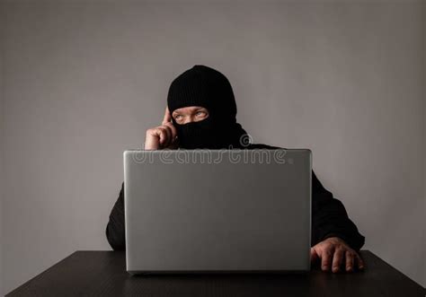 Hacker In Mask Using A Laptop Stock Image Image Of Privacy Anonymous