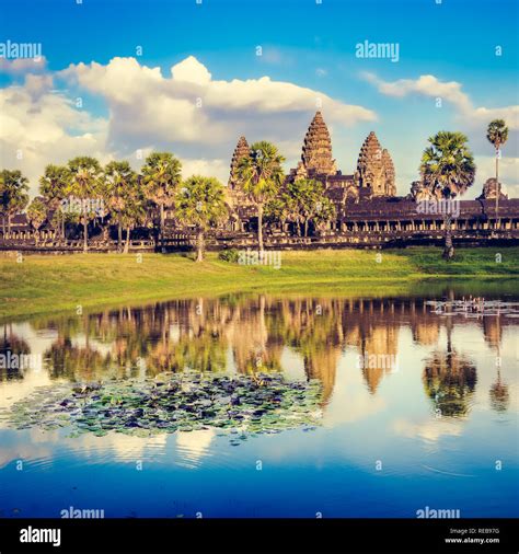 Angkor Wat Temple Reflecting In Water Of Lotus Pond At Sunset Siem