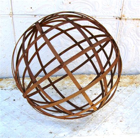 Builders, craftsmen, and artists have relied on wrought iron handrail for use in their projects for decades because of the material's decorative elements. 18" Metal Strap Ball - Wrought Iron Yard Art