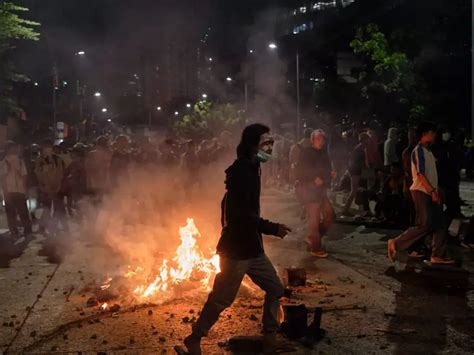Indonesian Police Fire Tear Gas And Water Cannons At Protesters Rallying Against A New Law That