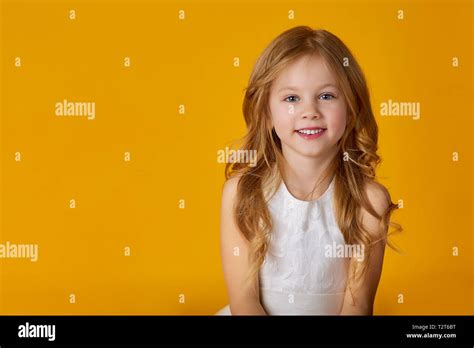 Kids Fashion Portrait Of A Cute 6 Year Old Girl In A White Dress