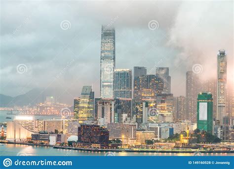 Kowloon Skyscrapers Night Skyline With Water Reflections Stock Photo
