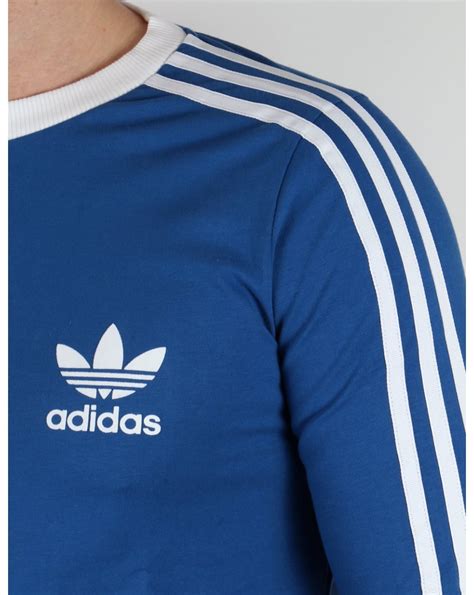 A trefoil logo on the chest flashes adidas pride. Adidas Originals 3 Stripes Long Sleeve T-shirt EQT Blue ...